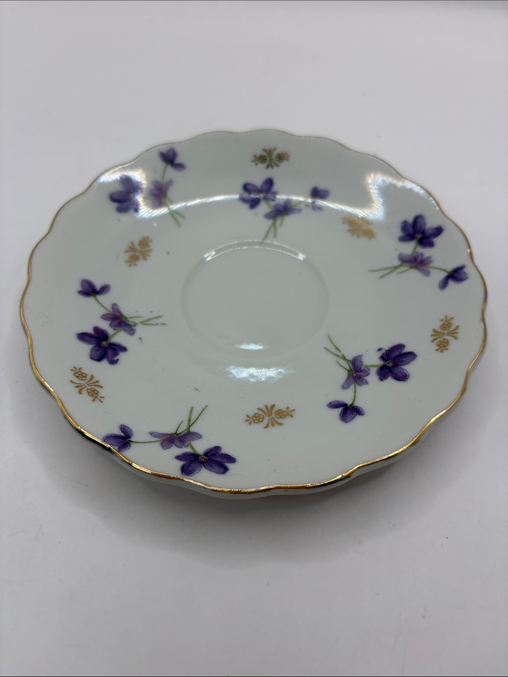 Saucer only for tea cup. Purple flower with gold trim